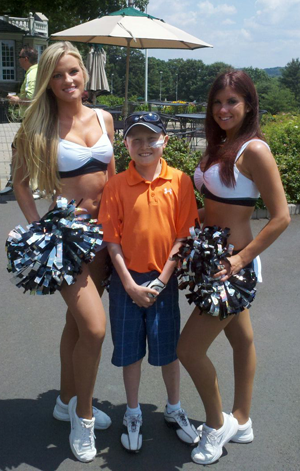 Hunter with Eagles cheerleaders